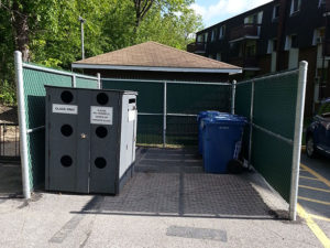 Chain link enclosure for apartment building recycling centre