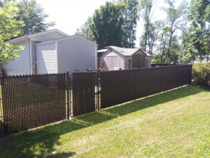 Residential chain link fencing with privacy slats