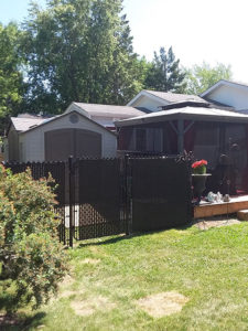 Residential chain link fencing with privacy slats