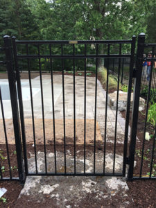 Majestic wrought-iron gate to patio